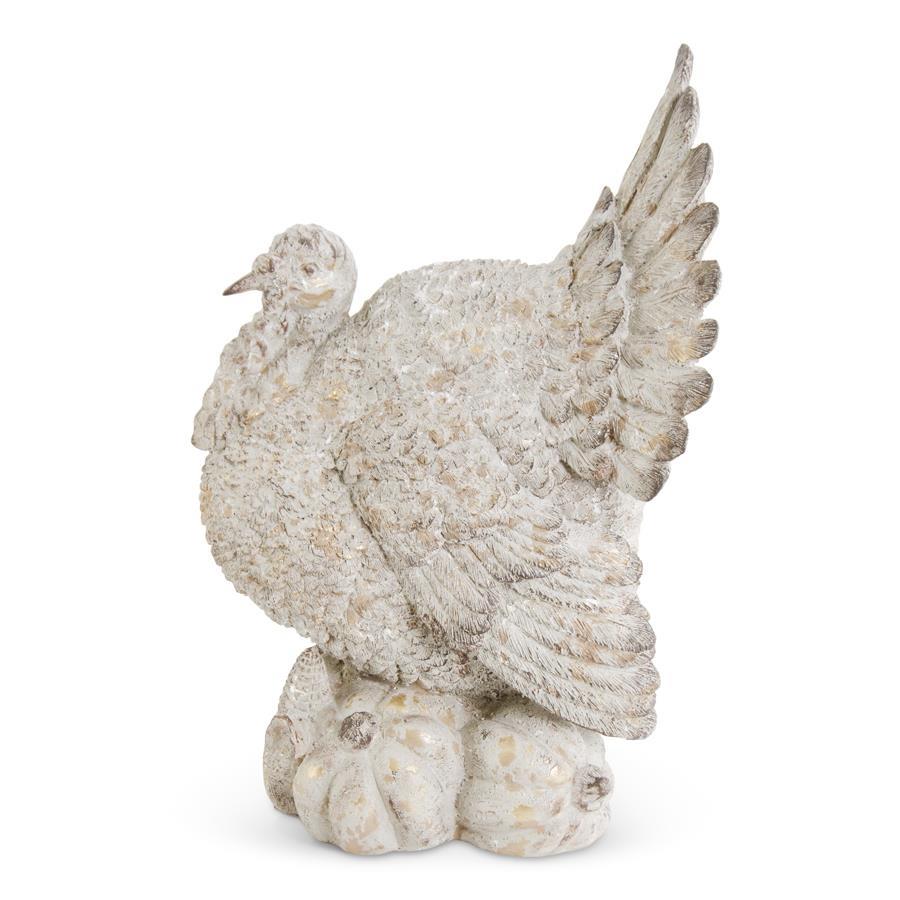An image of K&K 15.75" Tan Distressed Resin Turkey on Pumpkins