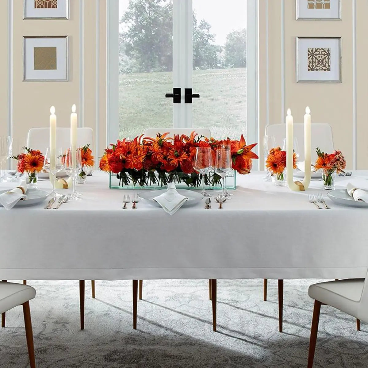 Sferra Classico White Napkin and tablecloth in a room with dinnerware 