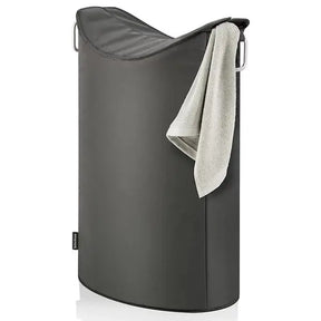 Blomus Frisco Laundry Bin in Silver with a towel hanging out