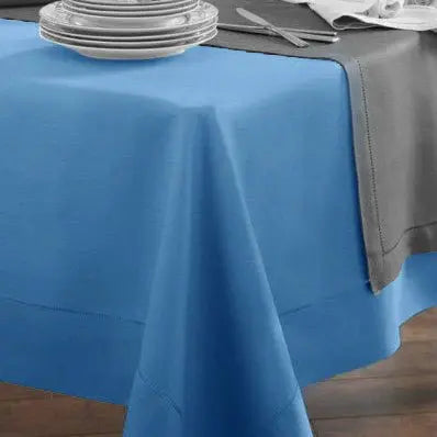 Sferra Festival Custom Tablecloth Cadet on a table