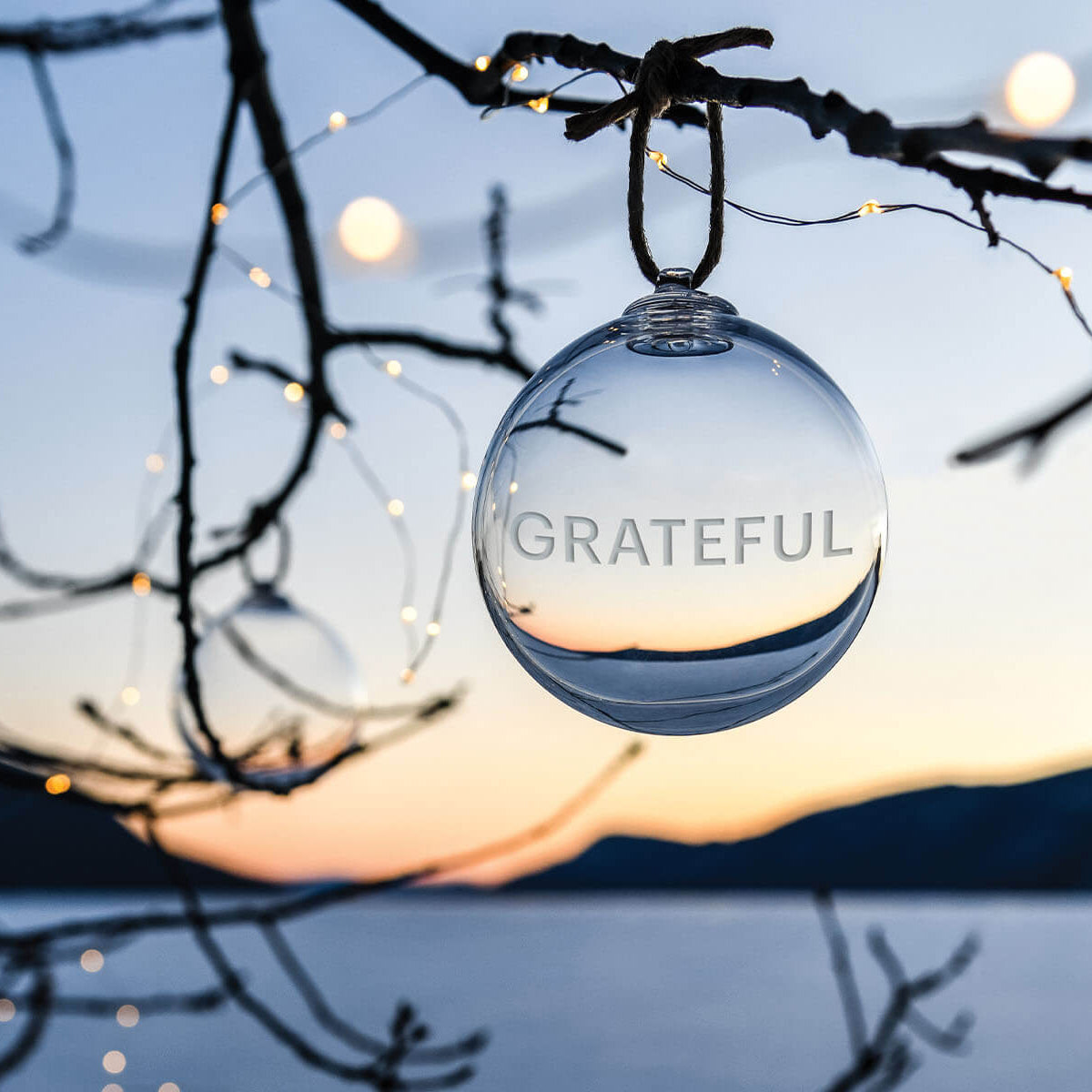 An image of Simon Pearce Engraved " Grateful" Ornament
