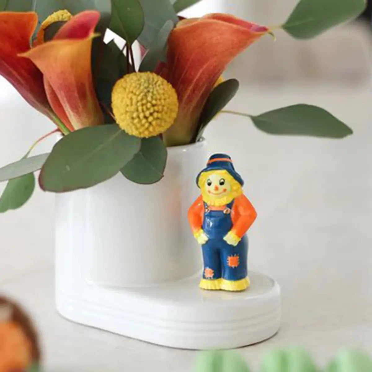 Nora Fleming Cutie Container with a scarecrow mini and fall flowers