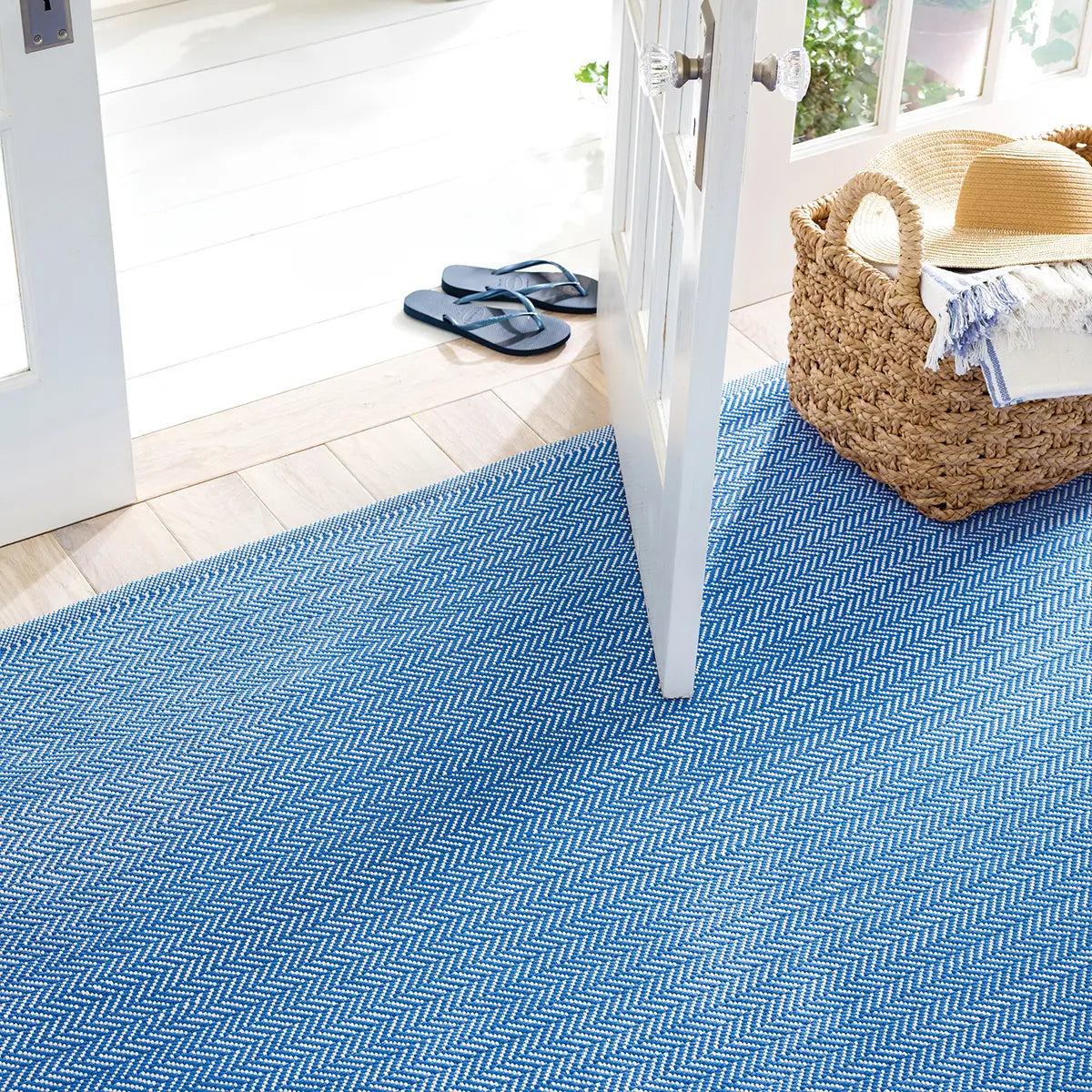 Dash and Albert Marlo French Blue Handwoven Indoor Outdoor Rug in a room