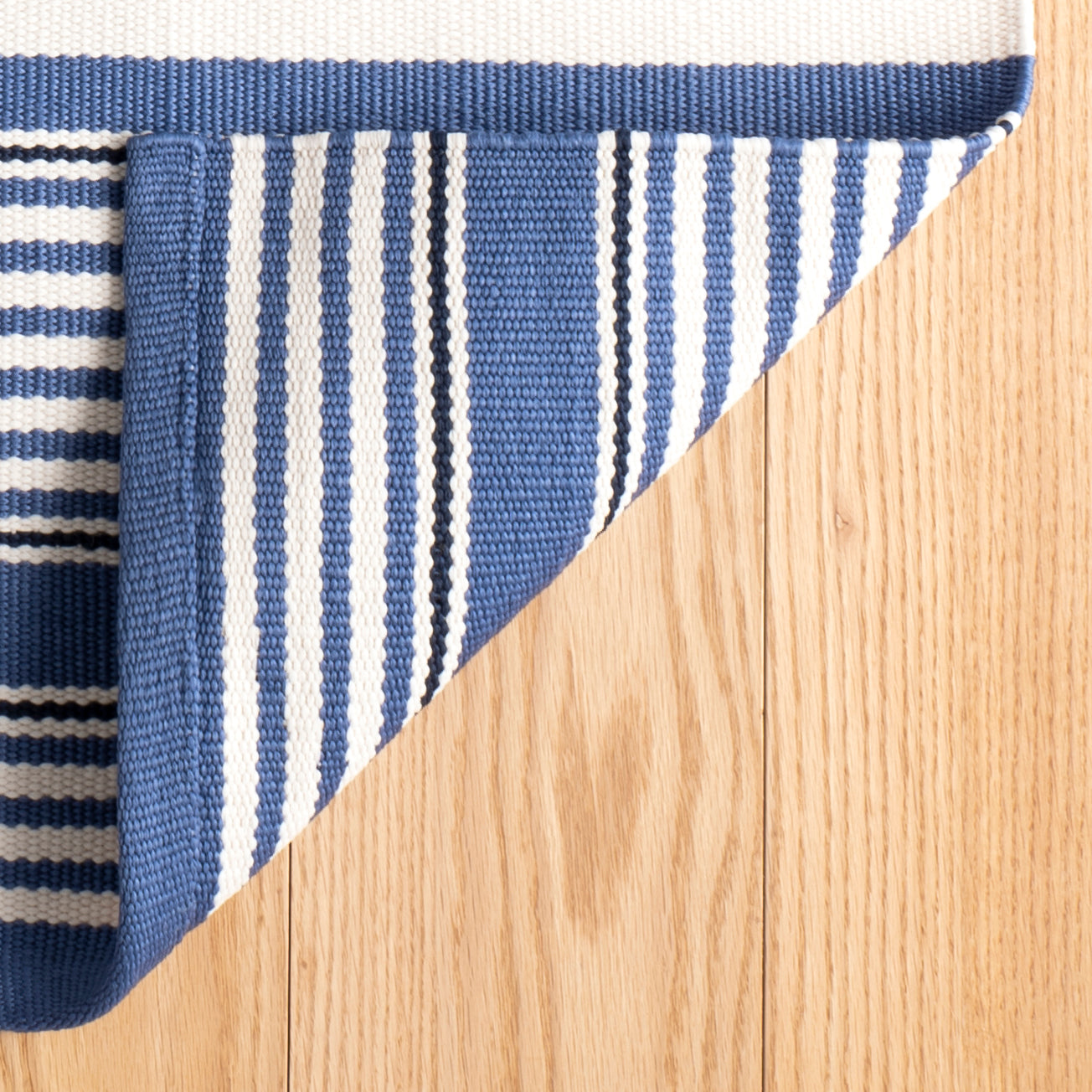 An image of Dash & Albert Rugby Stripe Denim Indoor/Outdoor Rug