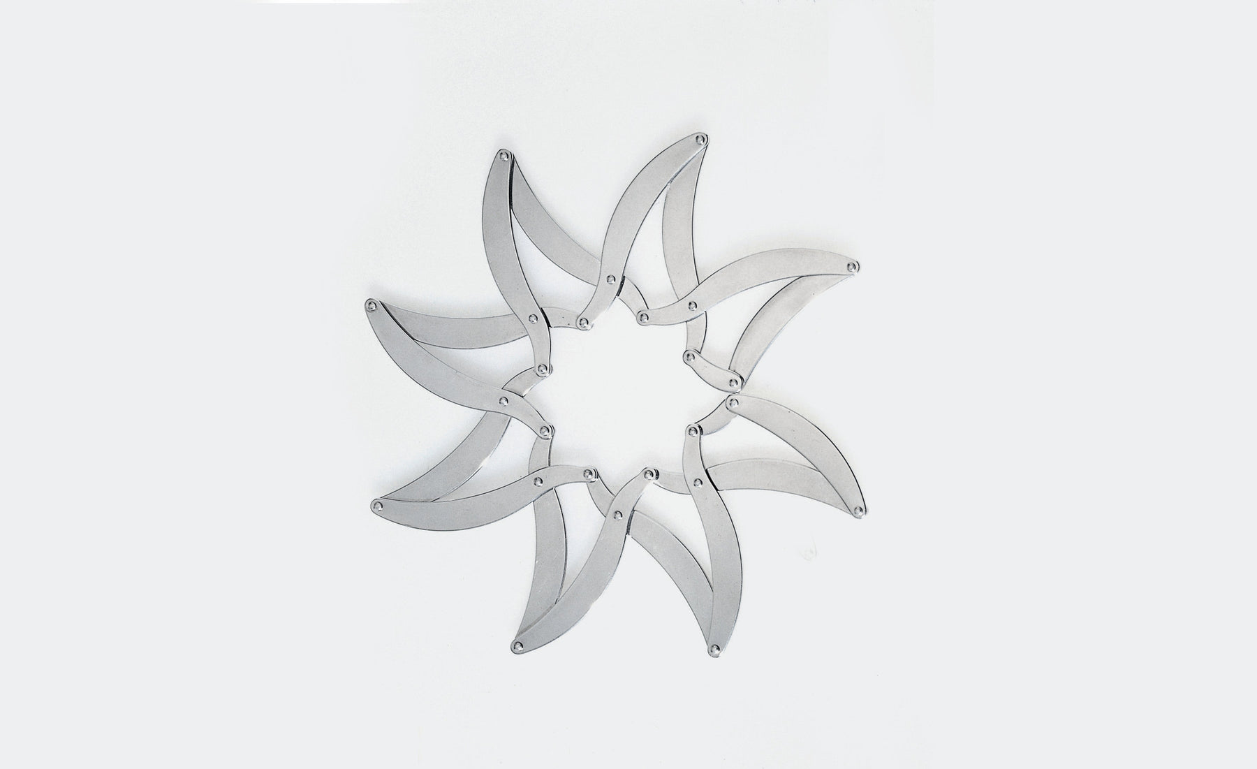 An image of Alessi D'Urbino-Lomassi Augh! Stainless Steel Expandable Trivet
