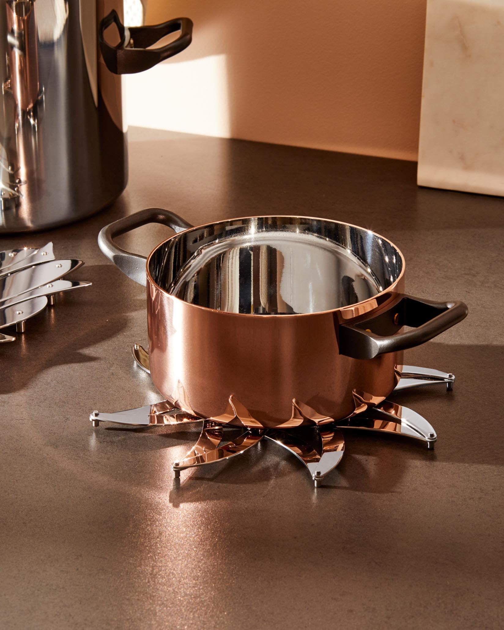 An image of Alessi D'Urbino-Lomassi Augh! Stainless Steel Expandable Trivet