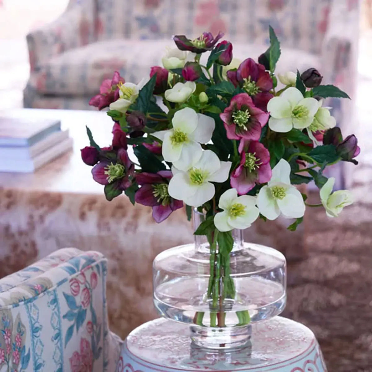 Diane James Mixed Helleborus Bouquet on a round side table in the living room