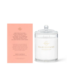 Glasshouse Fragrances A Place in Paris Soy Candle Violet and Patchouli back of box reading, Away from the chaos, notes of bergamot, violet and lily of the valley accompany rich cedarwood and amber, ascend to your own parisian oasis for a dalliance behind closed doors.  We want you to love every moment of this scented soy candle. Glasshouse fragrances candles have been created using only the highest quality soy blend wax and all natural led-free cotton wicks, which encourage a burn that is pure and intensely