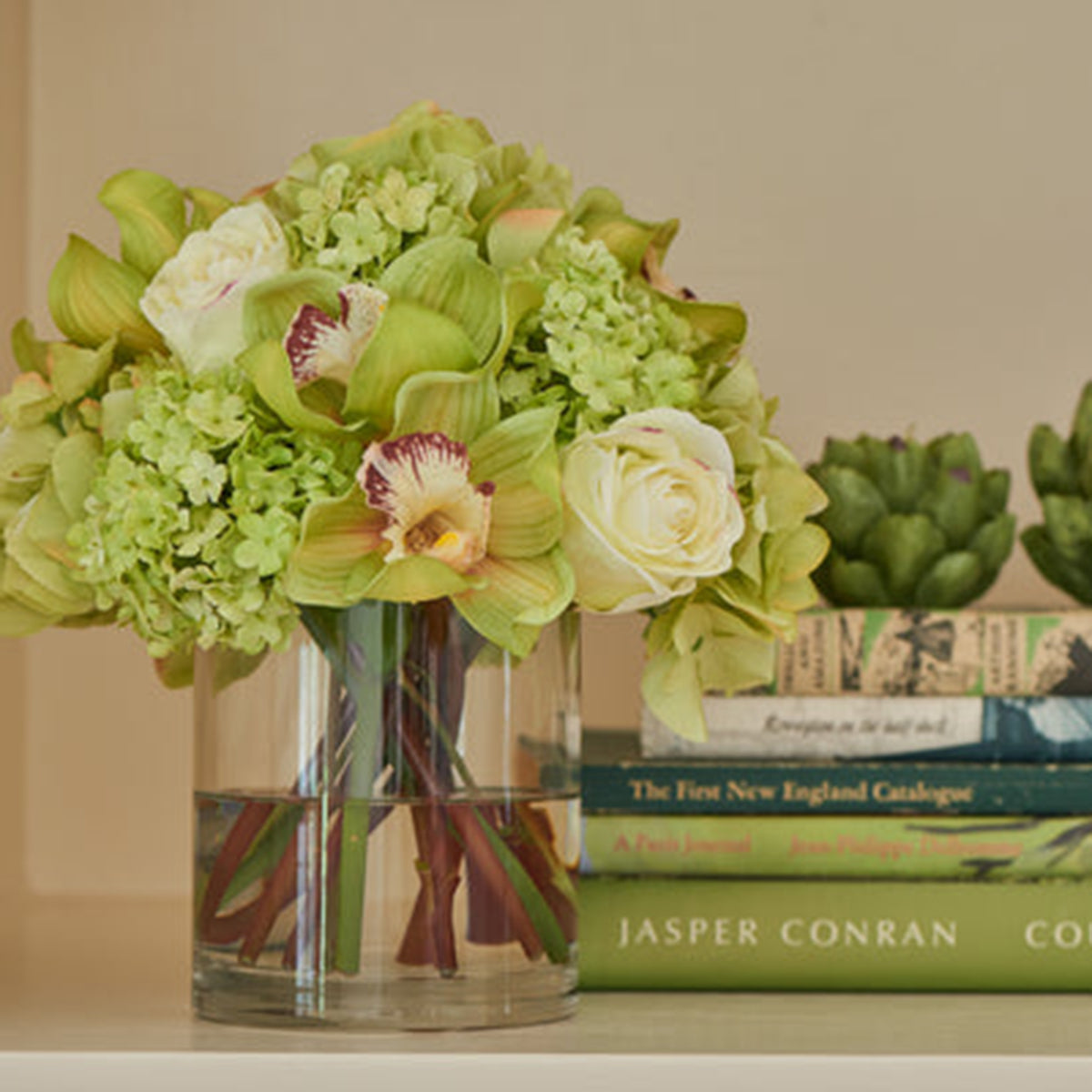 An image of Diane James Hydrangea and orchid bouquet in glass cylinder - 10"d x 10"h