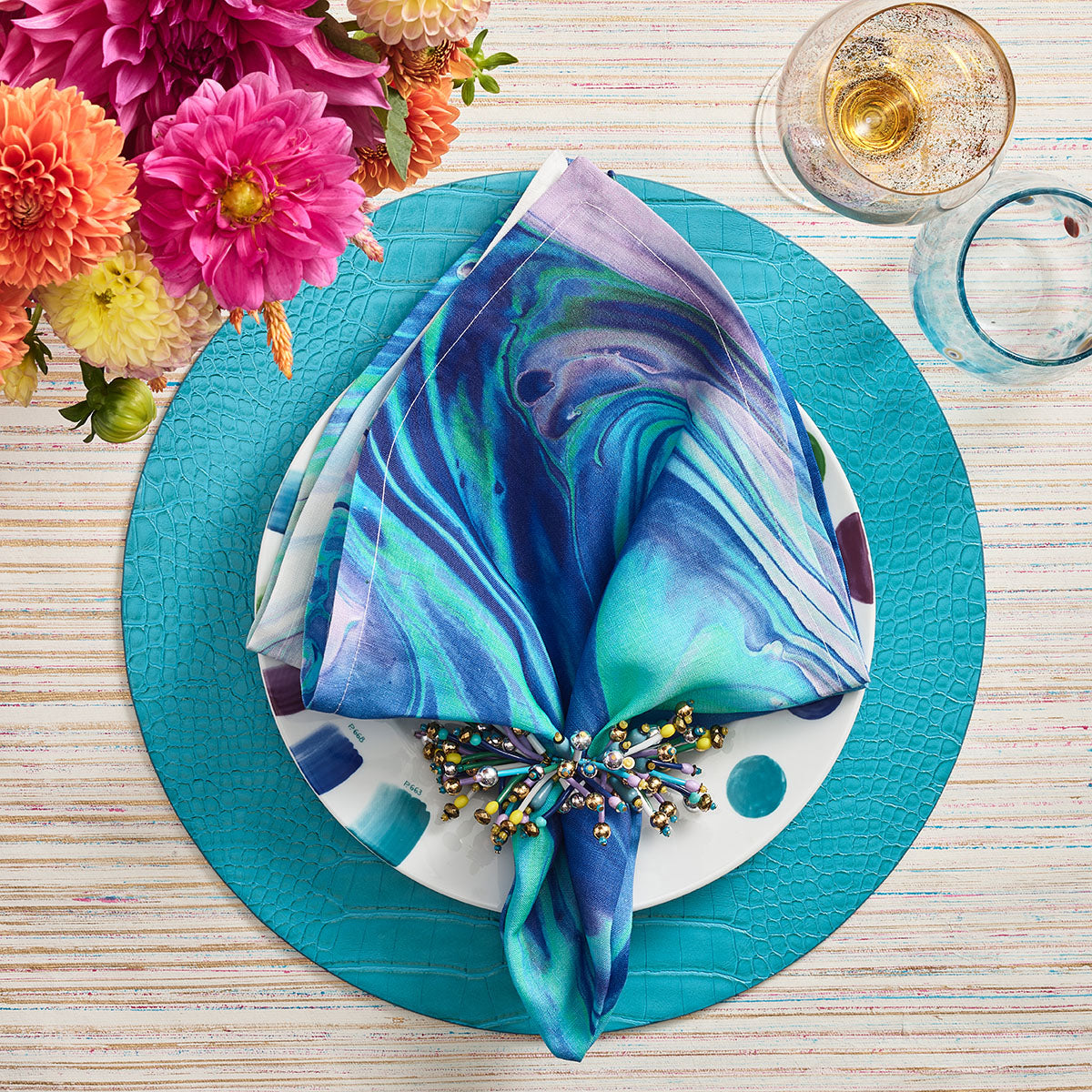 An image of Kim Seybert Splash Napkin - Blue/Seafoam