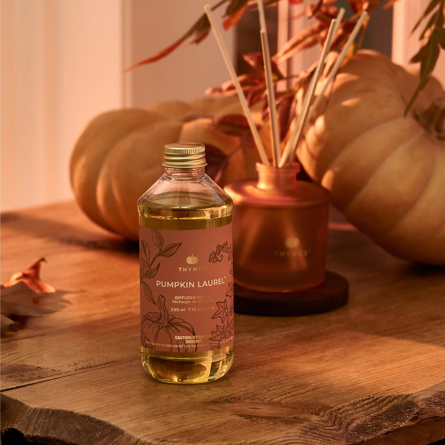 An image of Thymes Pumpkin Laurel Reed Diffuser Oil Refill 7.75 oz