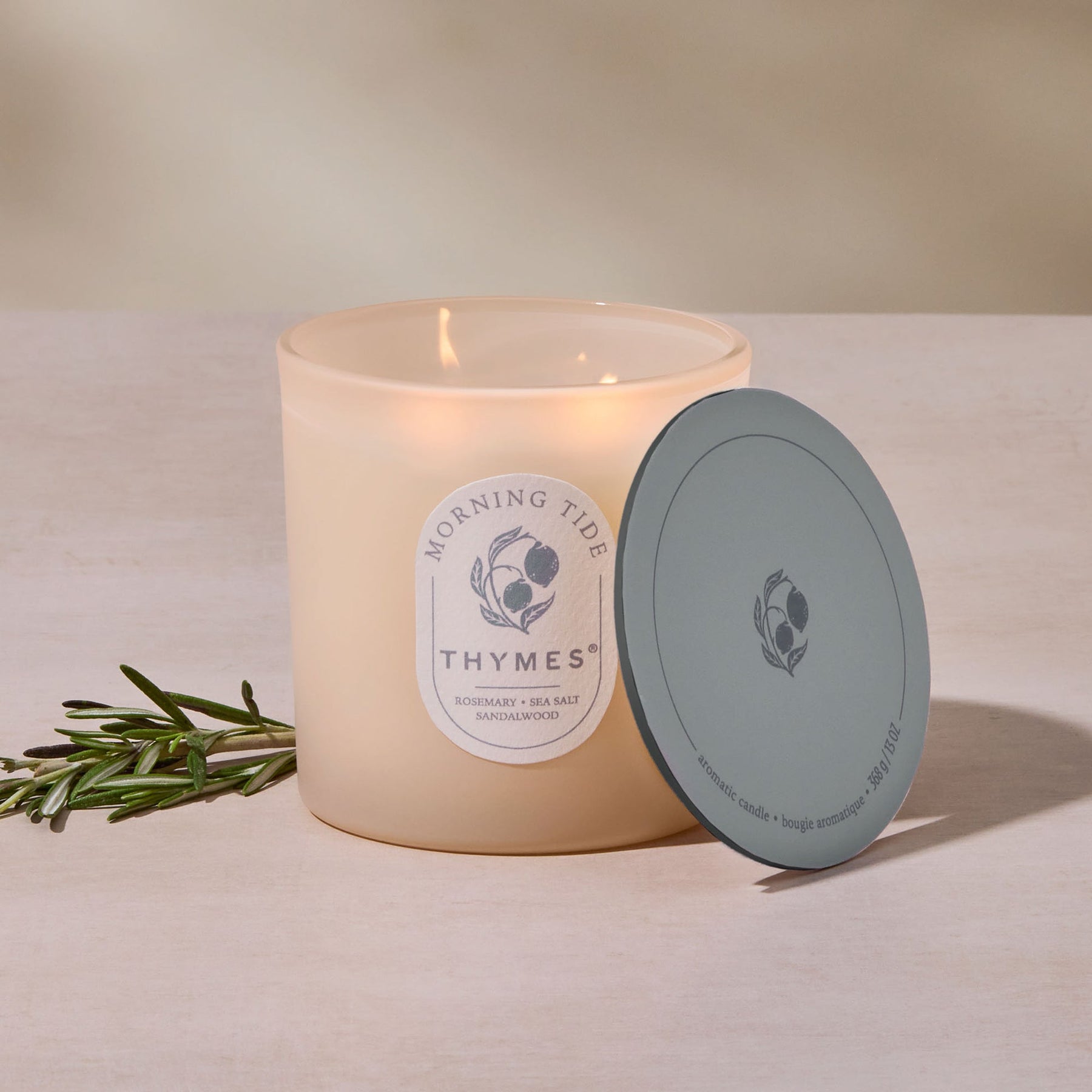 An image of Thymes Morning Tide Hours Edit Candle - 13 oz