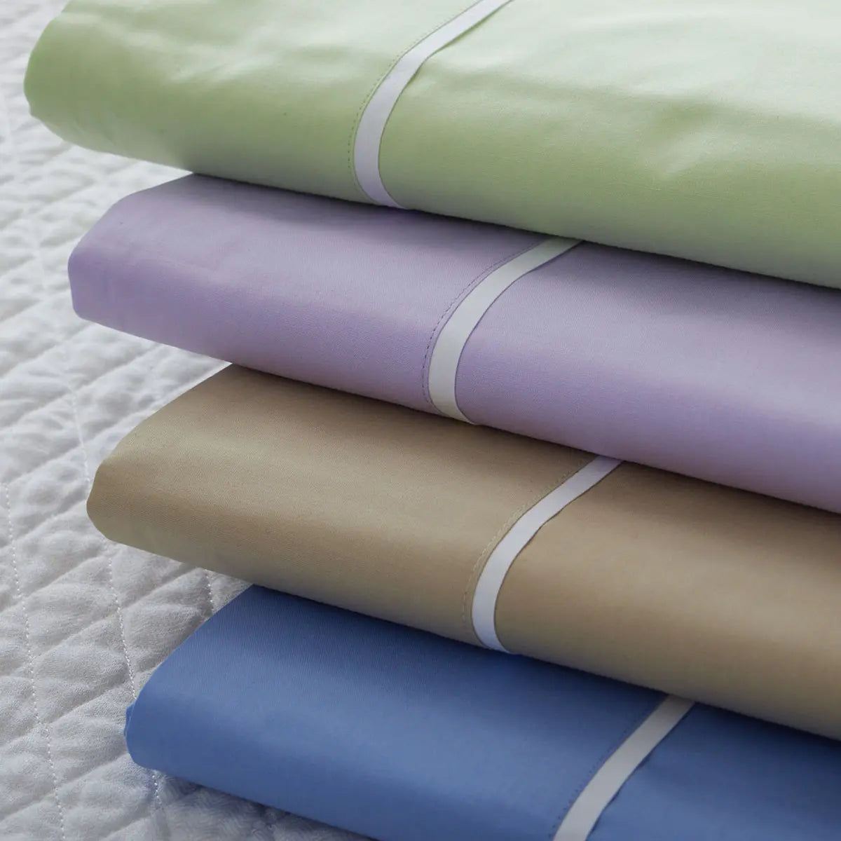 Gracious Home Bali Flat Sheet in various colors stacked together