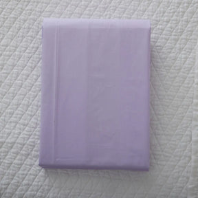 Gracious Home Bali Fitted Sheet in Lilla Lilac on a bed