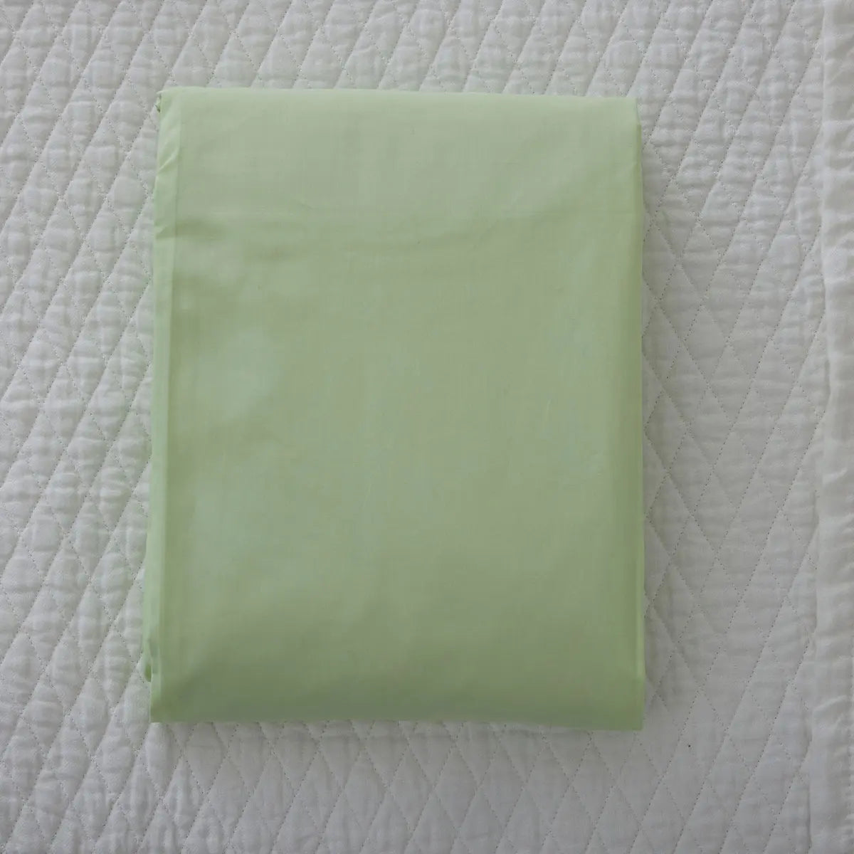 Gracious Home Bali Fitted Sheet in Mint Pastel on a bed