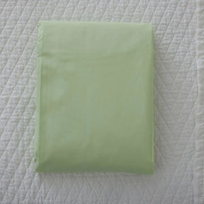 Gracious Home Bali Fitted Sheet in Mint Pastel on a bed