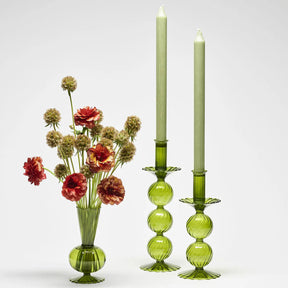 Kim Seybert Bella Olive Candlesticks set with candles and flowers