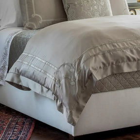 Lili Alessandra Vendome Duvet Cover in Taupe and Fawn draped on a bed in a room