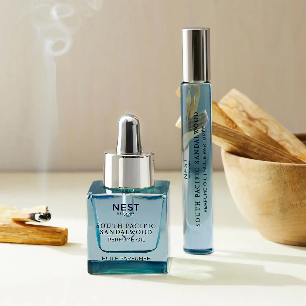 Nest Perfume Oil 30mL/1.0 fl oz. and Rollerball 6mL/0.2 fl oz. in South Pacific Sandalwood in a room with a diffuser