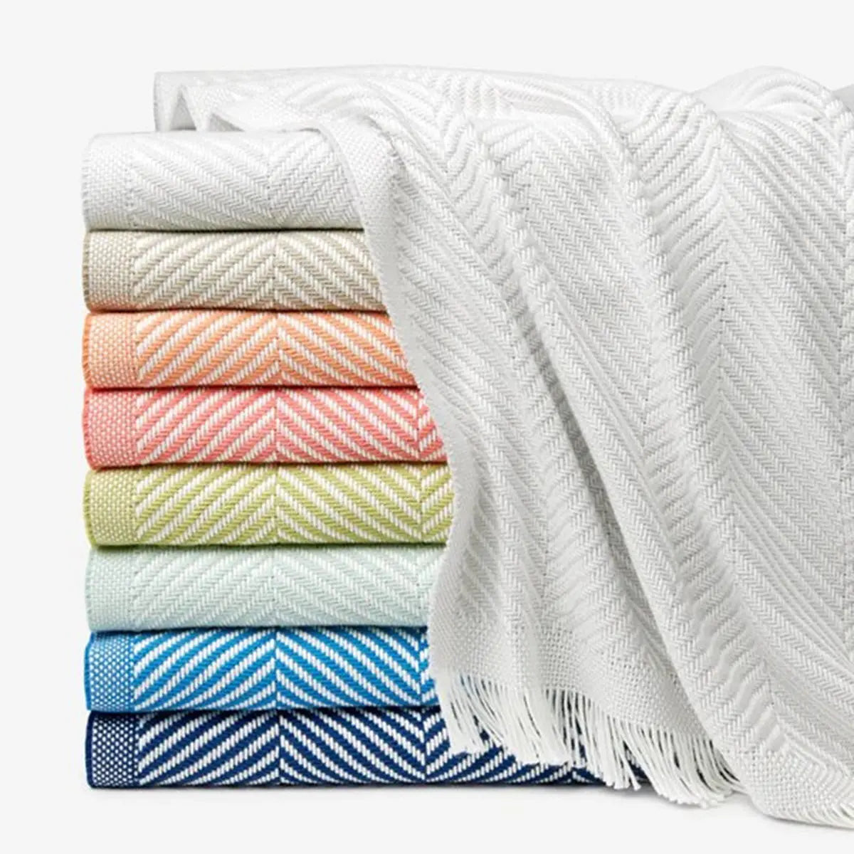 Sferra Costa Throws in various colors, stacked together
