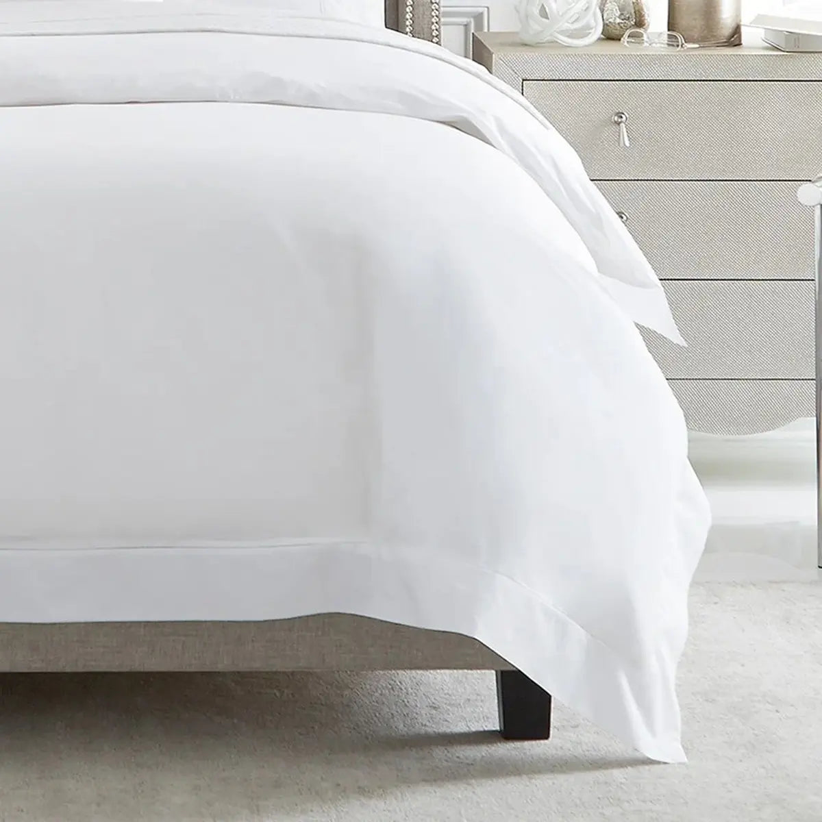 Sferra Giza 45 Percale Duvet Cover in White on a bed