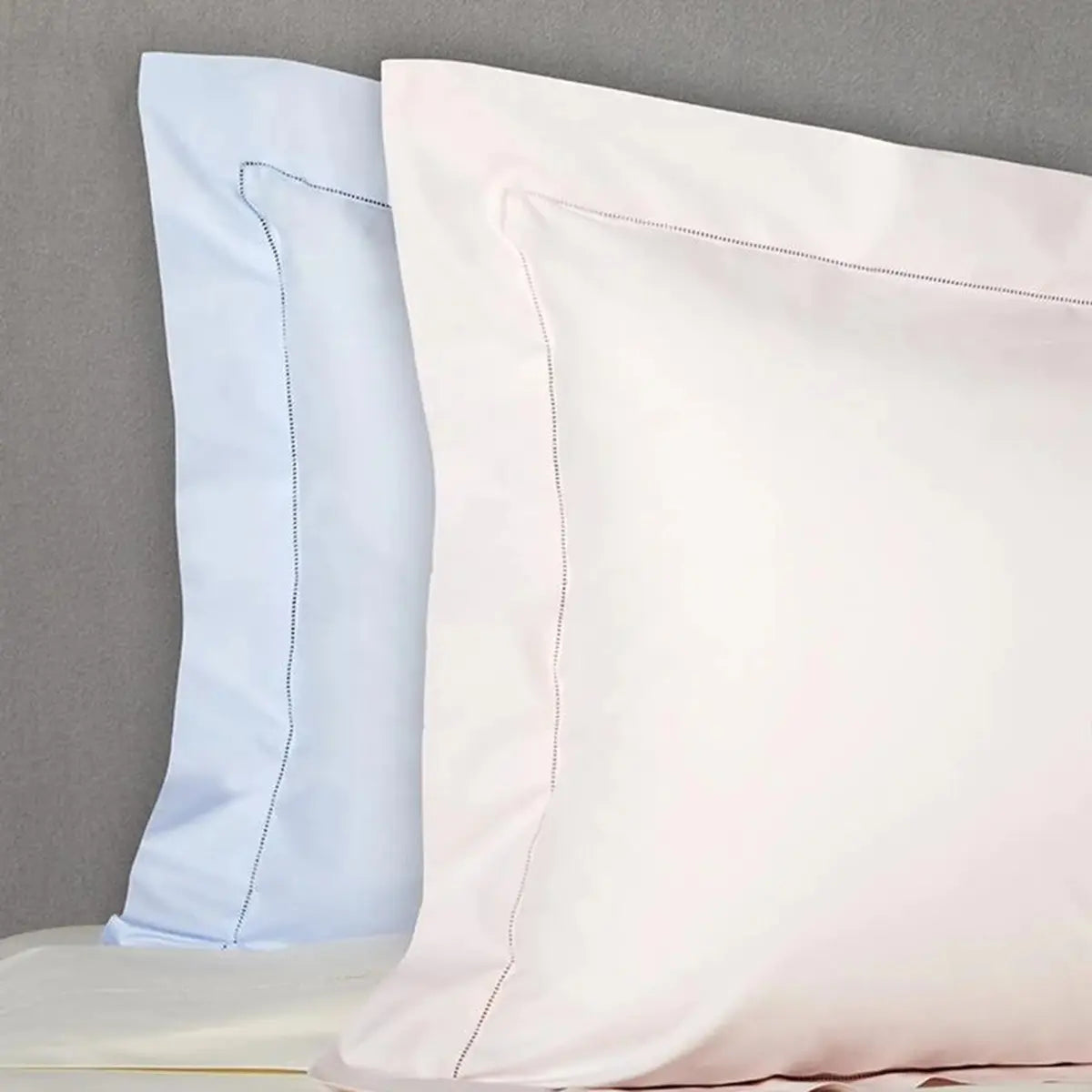 Two Pillowcases on top of a bed