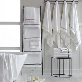 Sferra Aura Bath Towel Collection hung on the wall in the bathroom