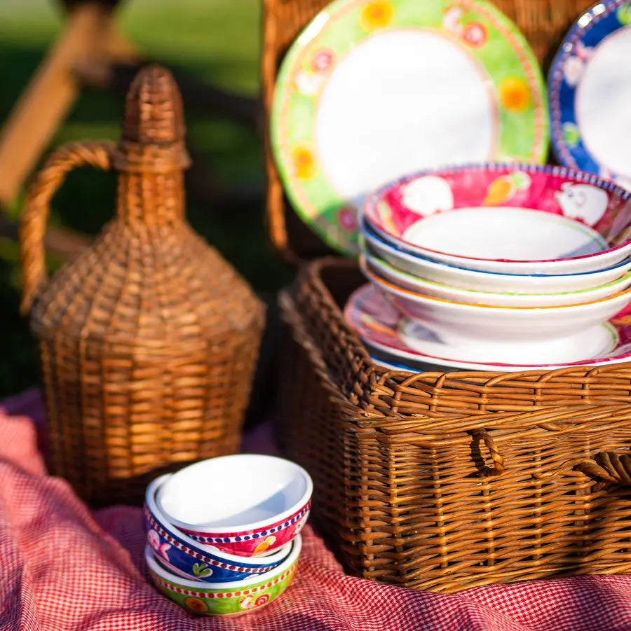 Vietri Campagna Melamine Gallina Bowls and Plates outside with baskets