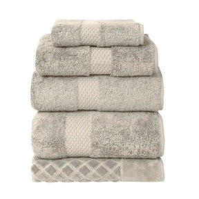 Yves Delorme Etoile Bath Towels and Rug Collection in Pierre color stacked together