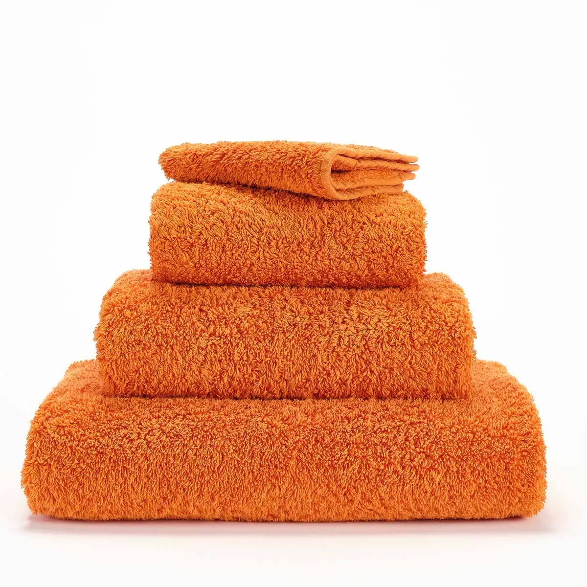 Abyss Super Pile Stack of Towels in Tangerine