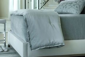 Lili Alessandra Aria Personal Throw Sky Matte Velvet  on a bed in a room