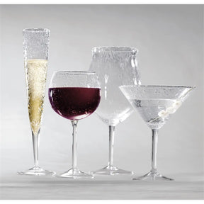 Mariposa Bellini Small Balloon Wine Glass filled with wine and set next to other glasses