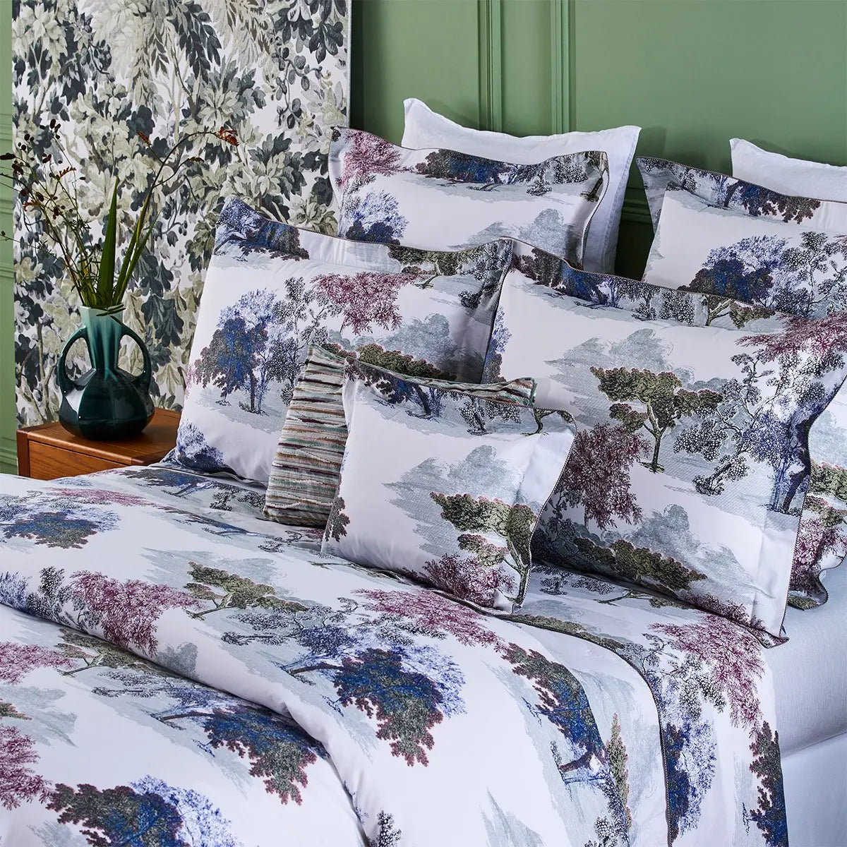 Yves Delorme Parc Bedding Collection draped on a bed in a room