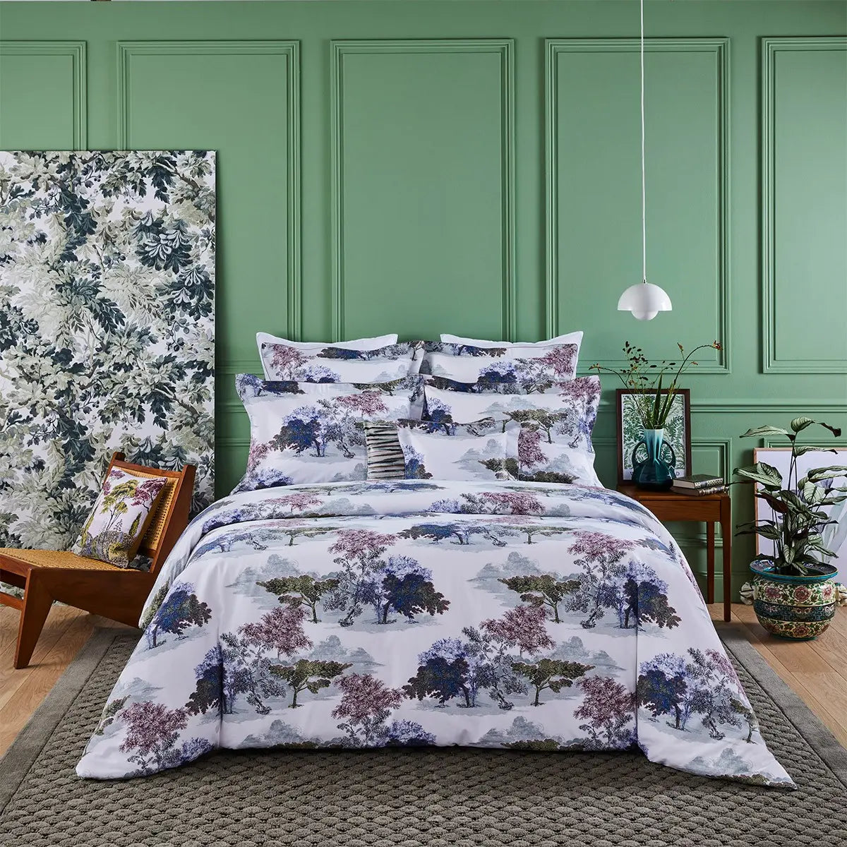 Yves Delorme Parc Bedding Collection draped on a bed in a room